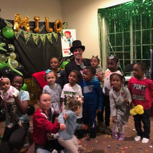 Magition Adam Stone with children party