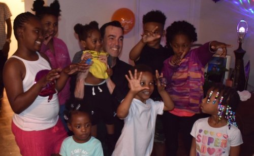 Kids enjoying a party with magician Adam Stone