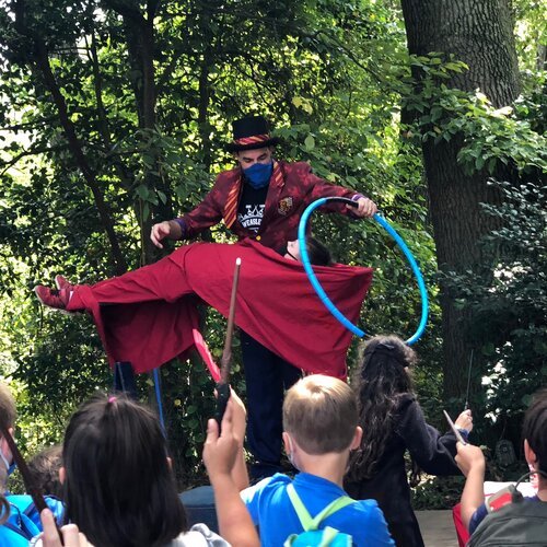 Adam Stone performed levitation magic at a children's party