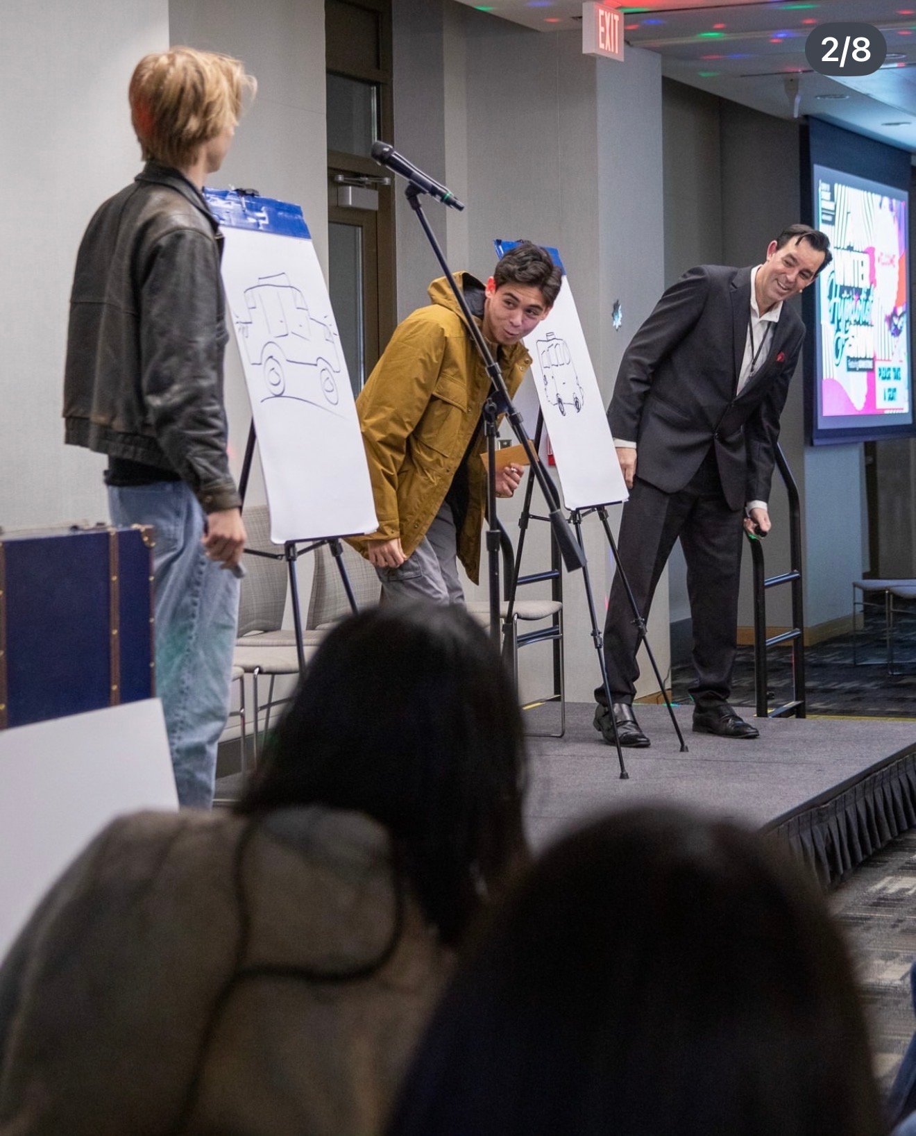 Adam Stone College Event Drawing Duplication Performance Adam Stone Magic Mentalist Adam Stone on Stage at a College Event with Two Student Participants During a Drawing Duplication Effect Mentalism Performance Tips