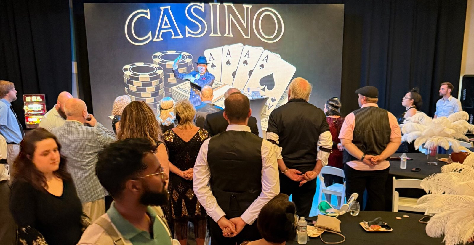 Mentalist Adam Stone Performing on Stage in a s Suit and Fedora for a Costumed Gatsby Party Audience Magician Vs Mentalist