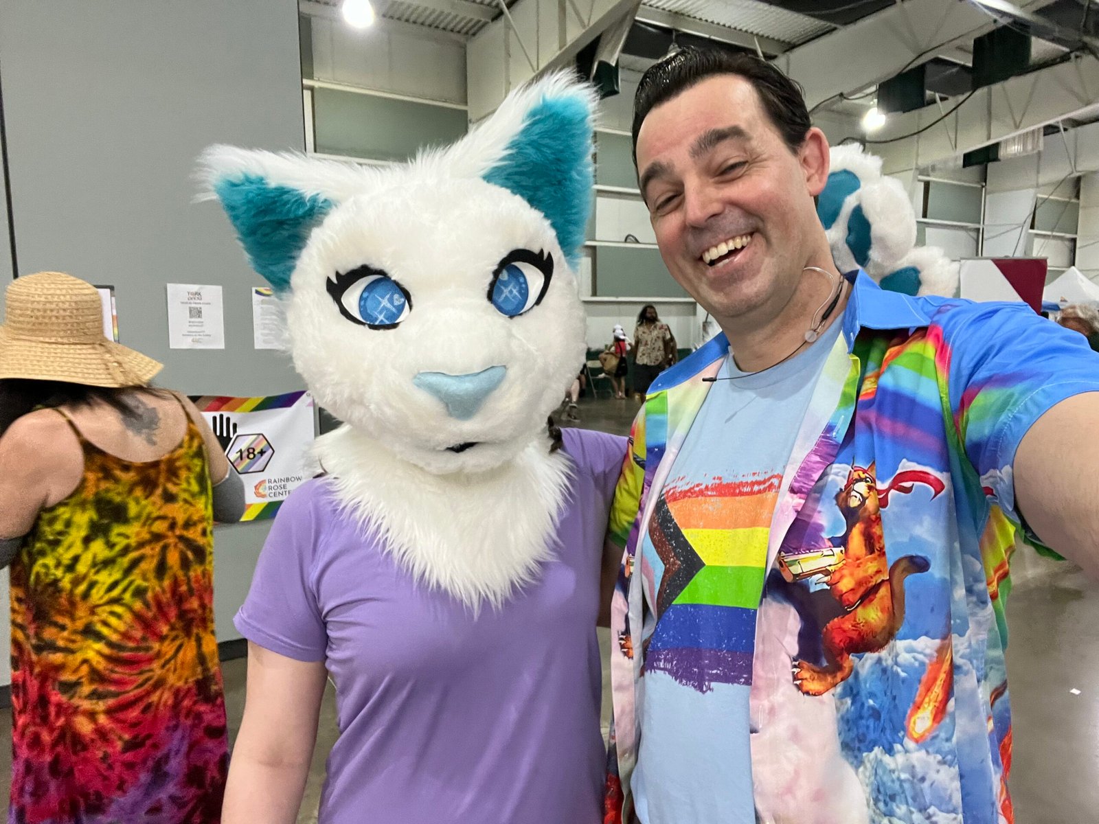 Adam Stone Pride Event Entertainment Adam Stone Magic Adam Stone Magic Mentalist Adam Stone Performing at a Pride Event Alongside a Guest Wearing a Large Cat Mask