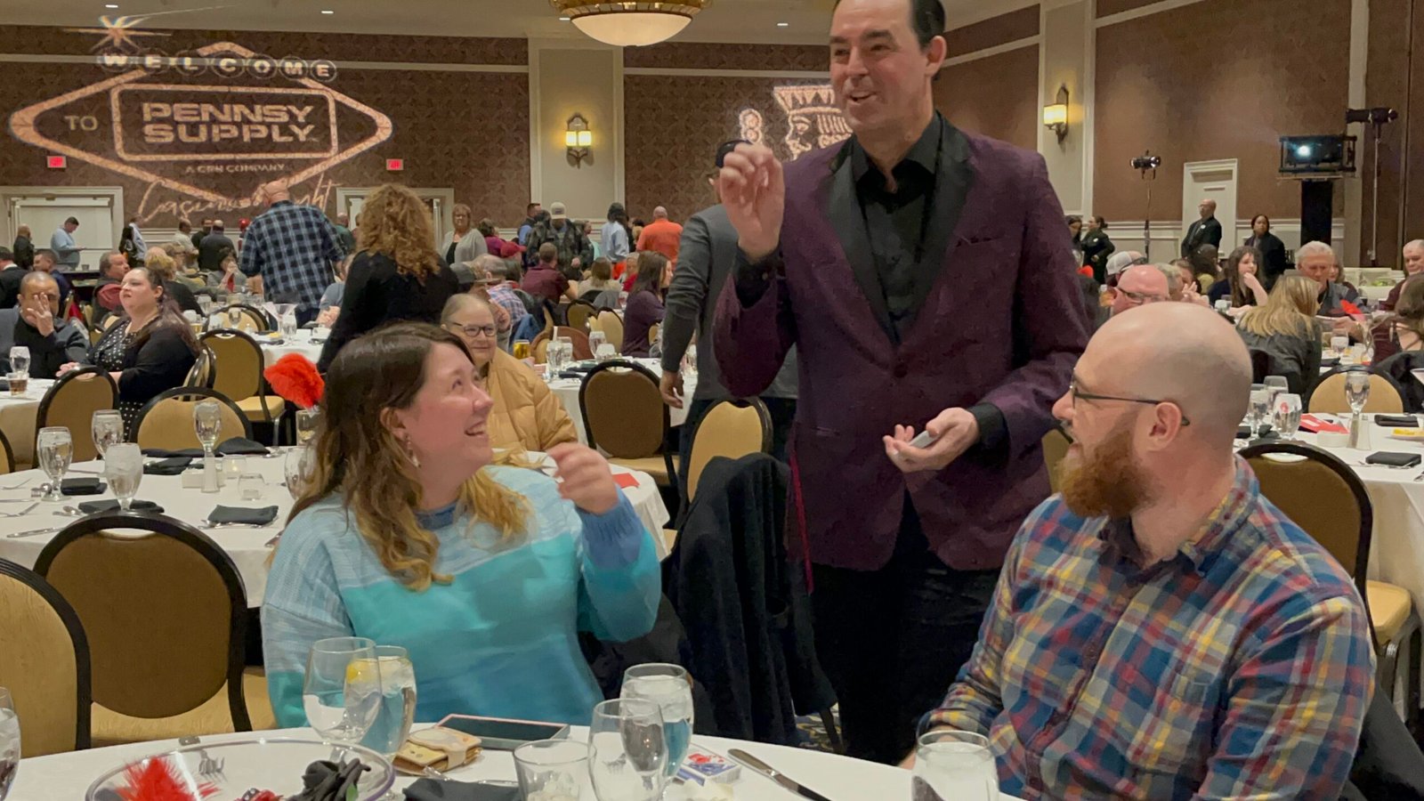 Adam Stone Corporate Dinner Strolling Performance Adam Stone Magic Adam Stone Magic Mentalist Adam Stone Performing Strolling Mentalism for Two Guests at a Corporate Dinner Event in a Full Banquet Hall