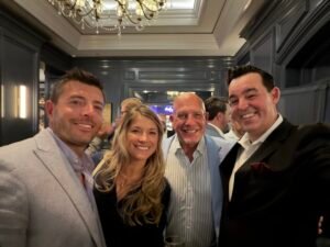 Corporate Mentalist Adam Stone with Three Smiling Guests Outside the Private Event Room at the Ritz carlton Washington Dc During a Mid atlantic Shoulder and Elbow Society Strolling Mentalism Performance