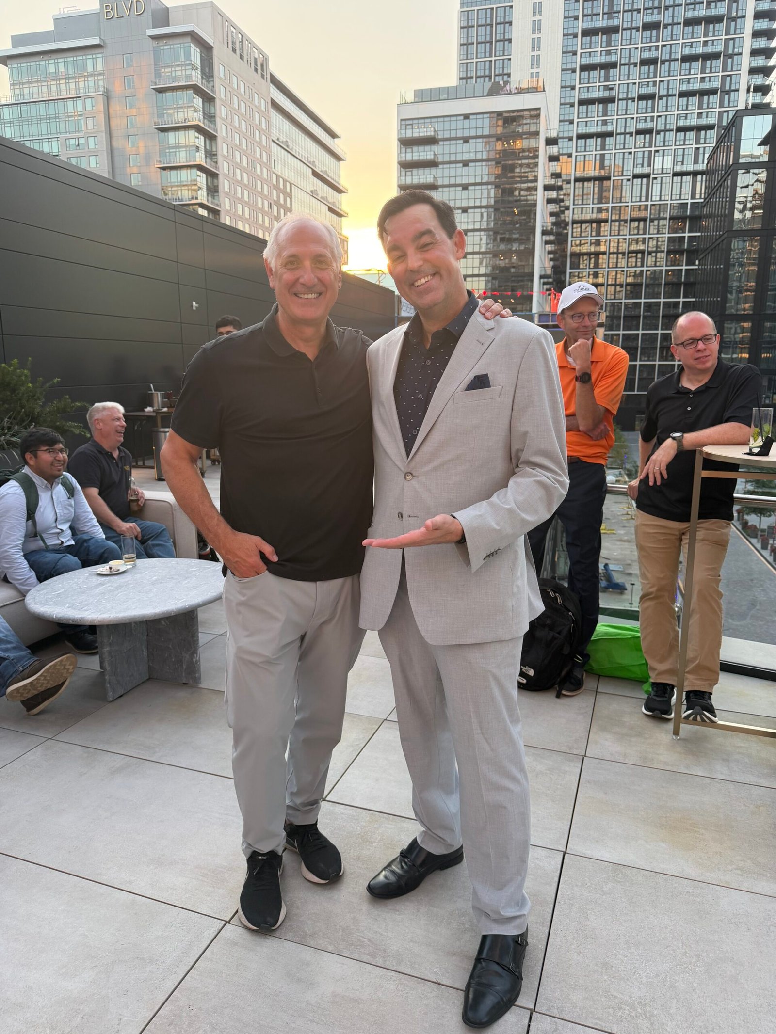 Adam Stone with Sunrise Senior Living Ceo Rooftop Jw Marriott Reston Adam Stone Magic Corporate Mentalist Adam Stone Standing with the Ceo of Sunrise Senior Living on the Rooftop at the Jw Marriott in Reston Virginia at Sunset